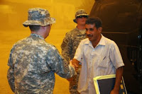 The Sons of Iraq meet with U.S. Soldiers for reconciliation at Joint Security Station War Eagle, in Baghdad.