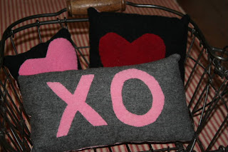 Valentine's Day themed throw pillows with "xo" and hearts