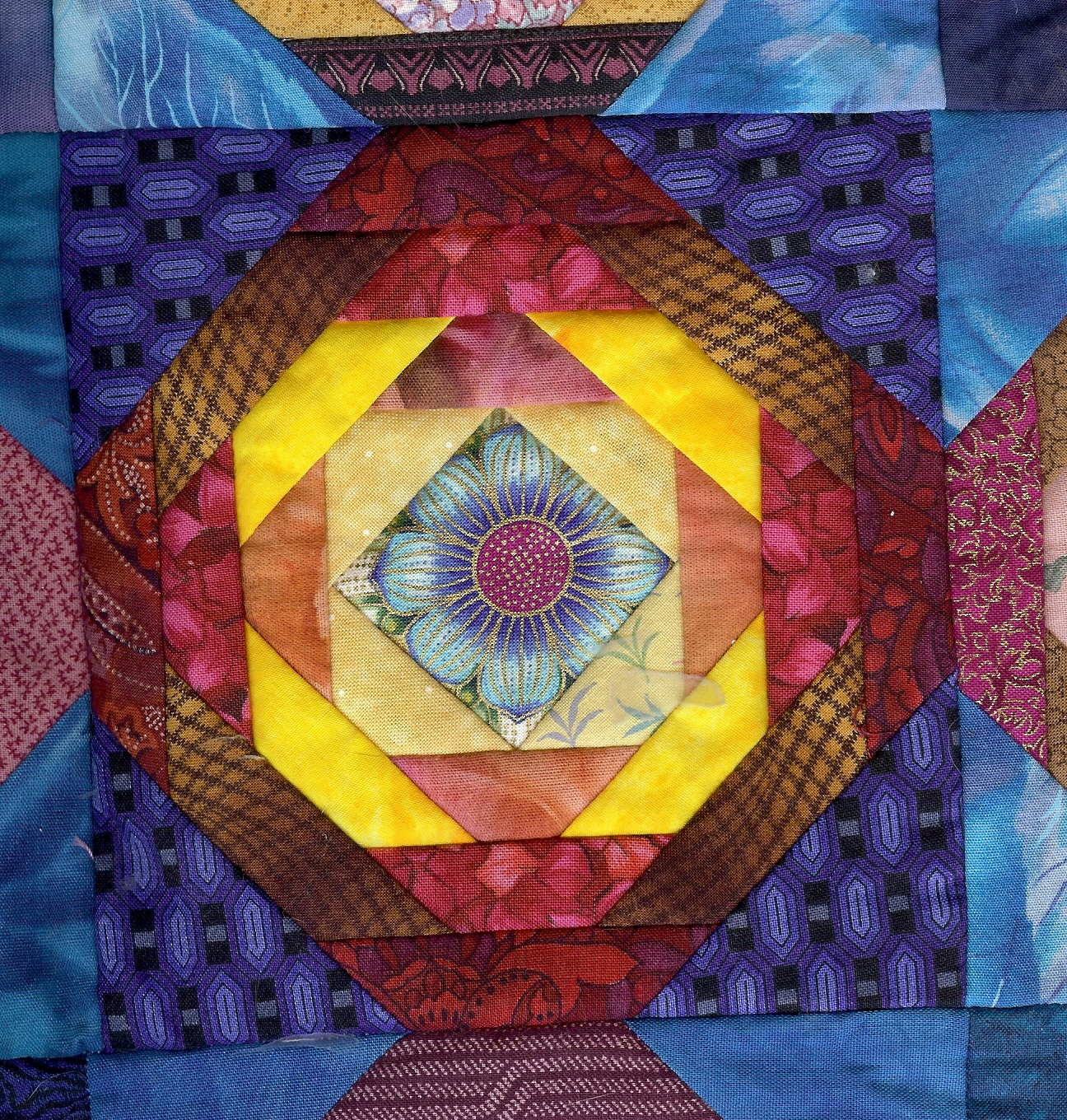 A Quilter doing Machine Embroidery Piece in the hoop