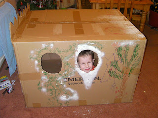 Santa in a large cardboard shipping box