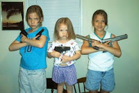 kids posing with guns