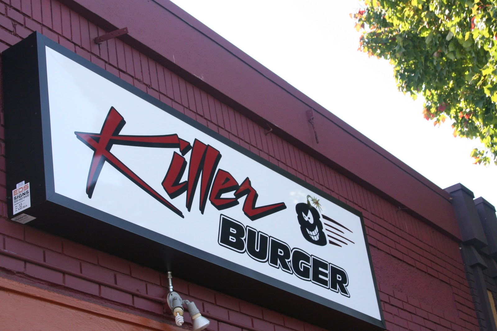 BIG GUY SHARING FOOD KILLER BURGER 47TH and Sandy