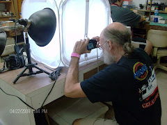 Bernie Reller taking a picture of his work
