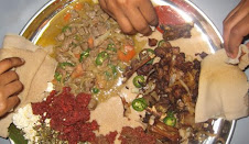 easting with gurusa with different vegetables and meat