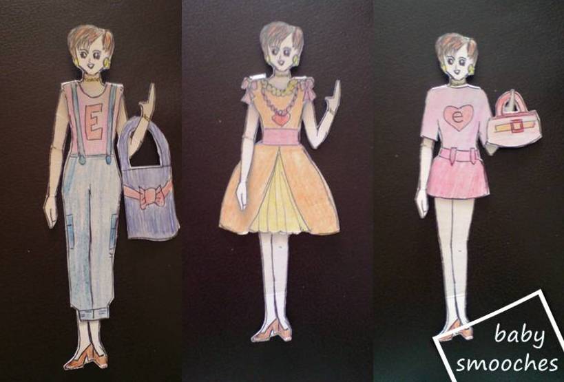 BabySmooches Playing dressup with cardboard doll