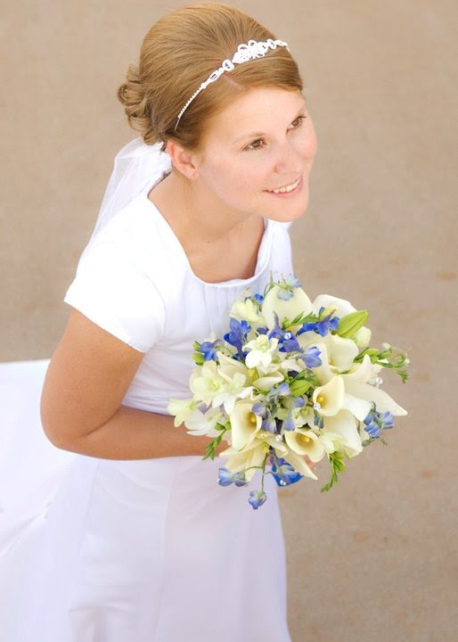 This is Megan and her bridal bouquet is with blue delphinium 