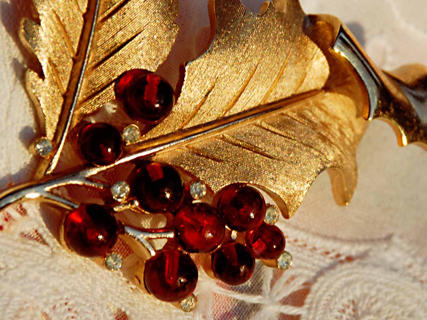 signed Trifari gold holly pin with red