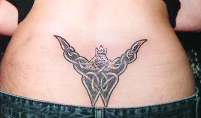cute butterfly tattoo images are created on the lower back tattoos very good body design