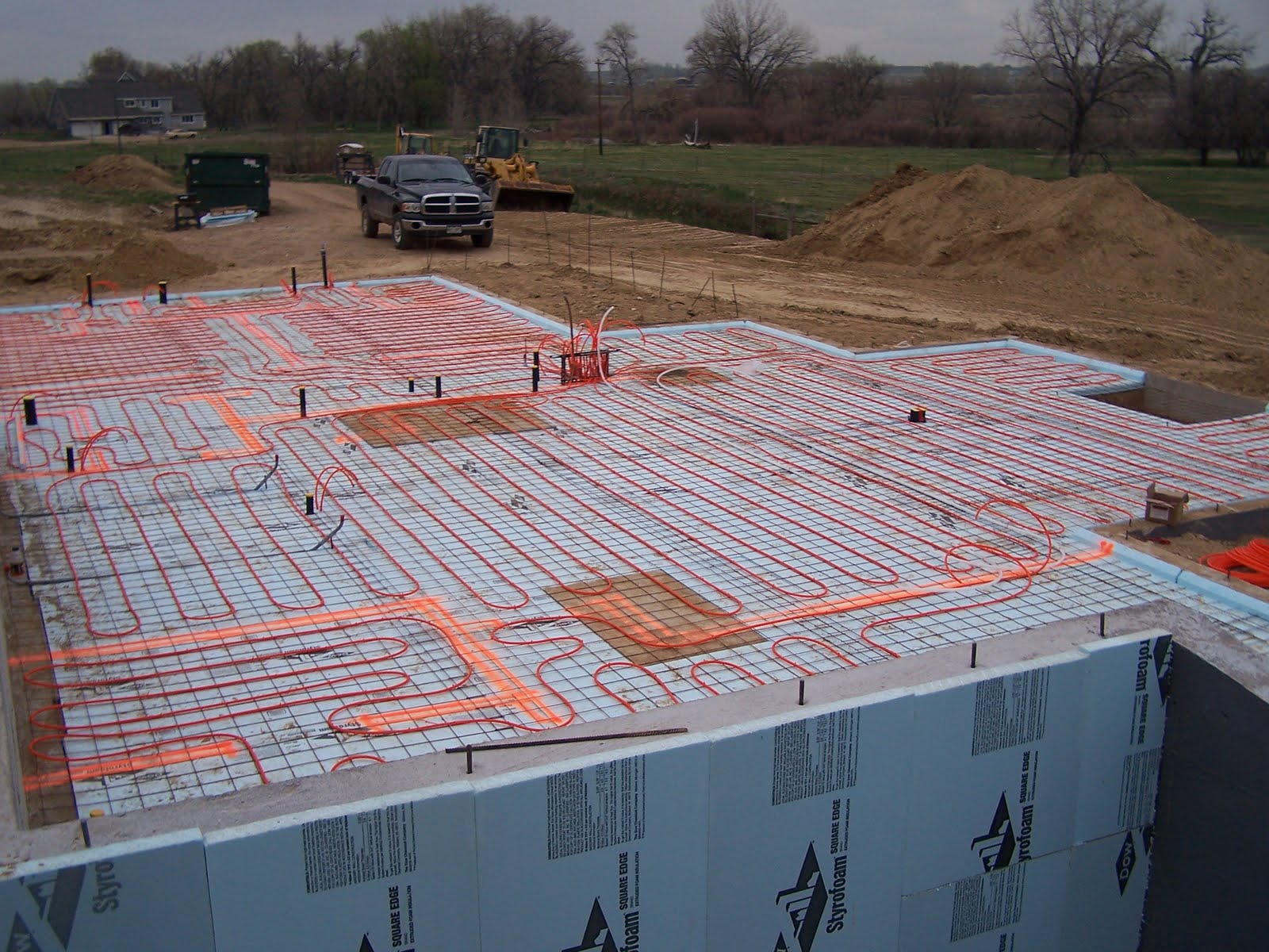 Home Construction Underslab insulation, radiant heat, and rain!