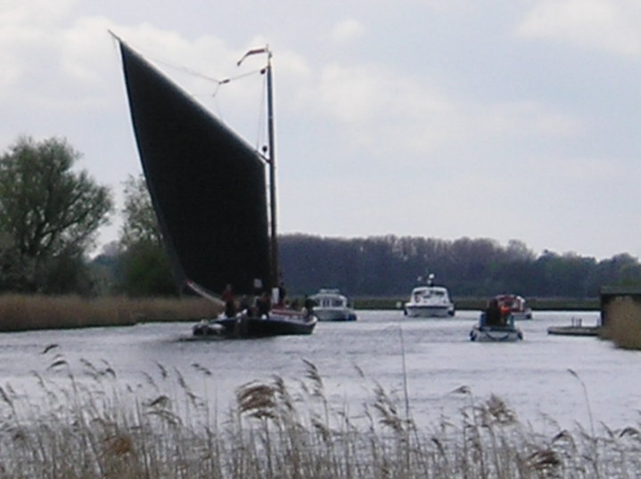 A wherry heads down the river Thurne