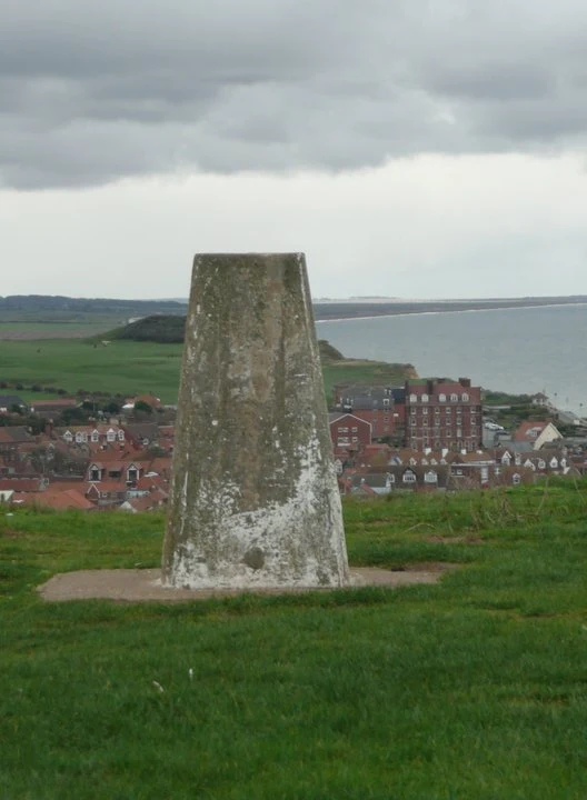 On the left, Cromer through one of its little alleyways, on the right the summit of Beeston Bump
