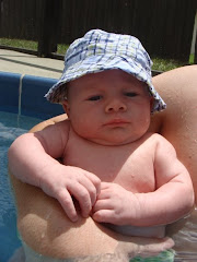 Swimming with his mommy and daddy