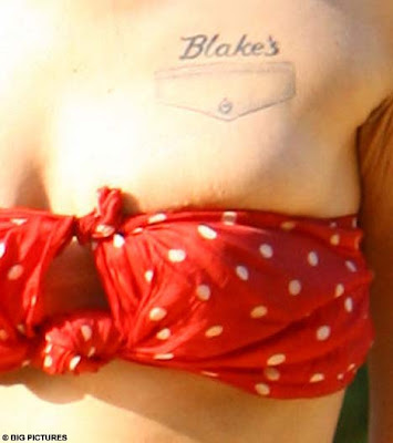 tattoo on boob. fake pocket on her oob.