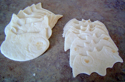 photo of cut out bat and cat shaped flour tortillas on a countertop