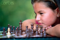 girl playing chess