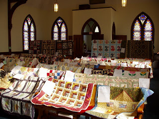another view of the church pews and quilts
