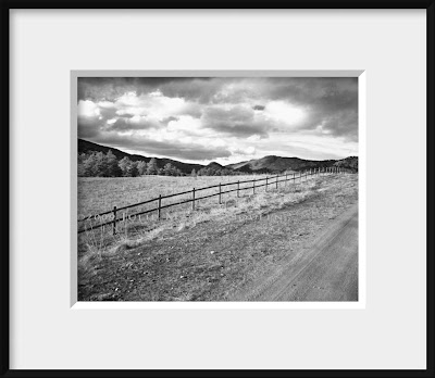framed black and white photo of western fence line and valley view in Colorado