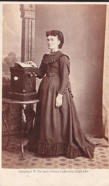 Pregnant woman with stereo viewer by T.Nevin 1870s