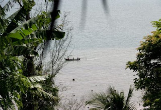 Longtail boat in Chalong Bay as seen from restaurant