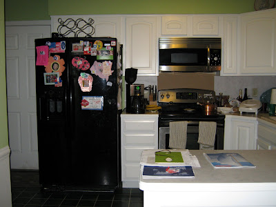 painting kitchen cabinets before and after. After shot: white cabinets and