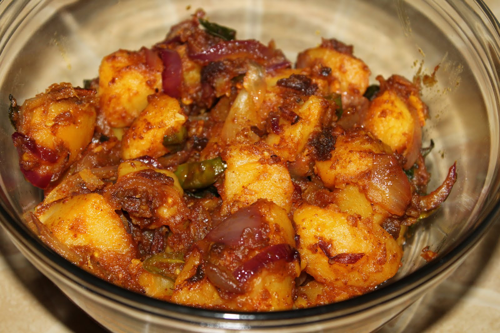 Side Dish Spicy Potato fry with onions and green chillies