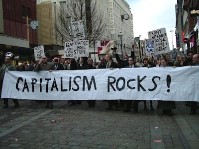 http://2.bp.blogspot.com/_D79P4Yb-iLc/SIm2wMnSLMI/AAAAAAAAAUs/zQbXZr7v4qc/s400/capitalism-rocks-protest.jpg