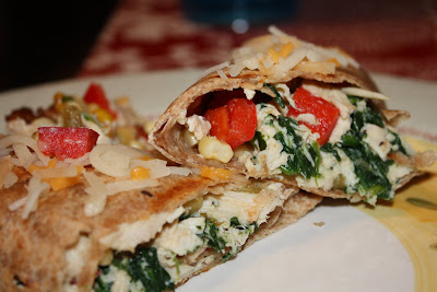 skillet-grilled burrito cut in half showing chicken and vegetables