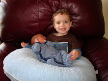 Nicholas holding William for the first time