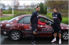 Neil Dymock in one of the cars along with Wales players Lewin Nyatanga and Gareth Bale