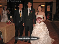 Jason Geh posing with newly weds Philip and Petrina