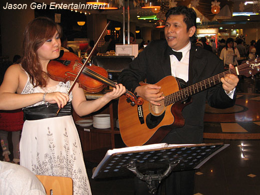 Strollers in KL, Malaysia with Violin Player, Guitar and Vocal