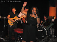 An image of Elvira singing with the band