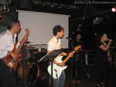 Image of a live band performing during a club gig in Kuala Lumpur , Malaysia