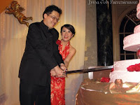 Bridal couple cutting the cake