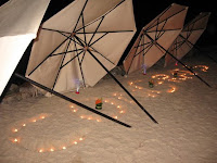 The word CONGRATS made on the sand by the beach where the bridal couple will have their final dance of the night