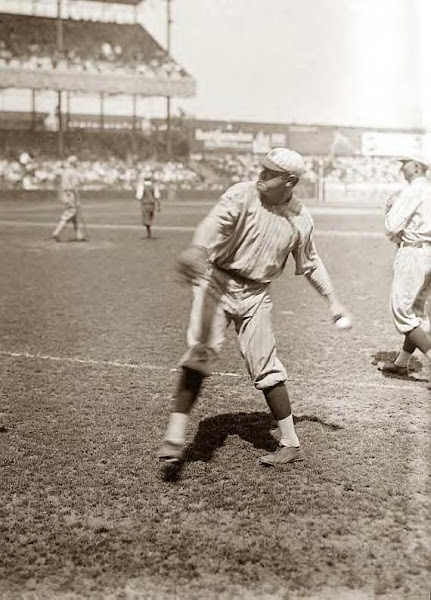 Babe Ruth throwing to baseman. Undated