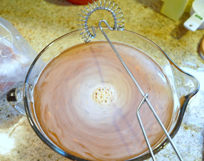 Brine for Crock pot turkey breast in a glass bowl with mixer