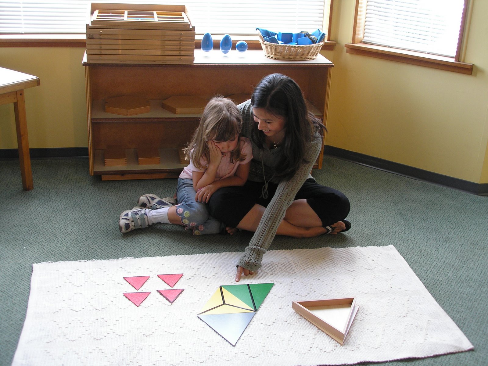 Gluing Redirecting Behavior NAMC Montessori Classroom Working Towards Normalization teacher and girl