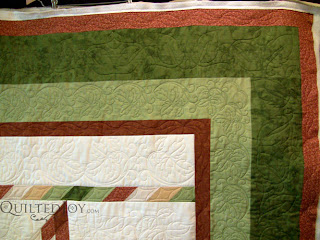 Foliage quilting theme on a Lone Star quilt - QuiltedJoy.com
