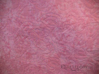 Spin Pantograph - Jelly Roll Pickety Sticks, quilted by Angela Huffman