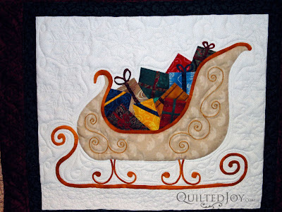 Eve's Santa Applique Quilt with custom quilting by Angela Huffman - QuiltedJoy.com