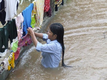 Salvaging Laundry at Height of Rain