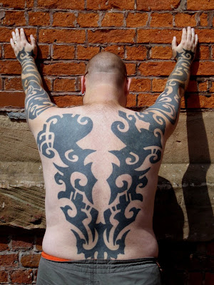 Full Body Tribal Tattoo from the hand to the back
