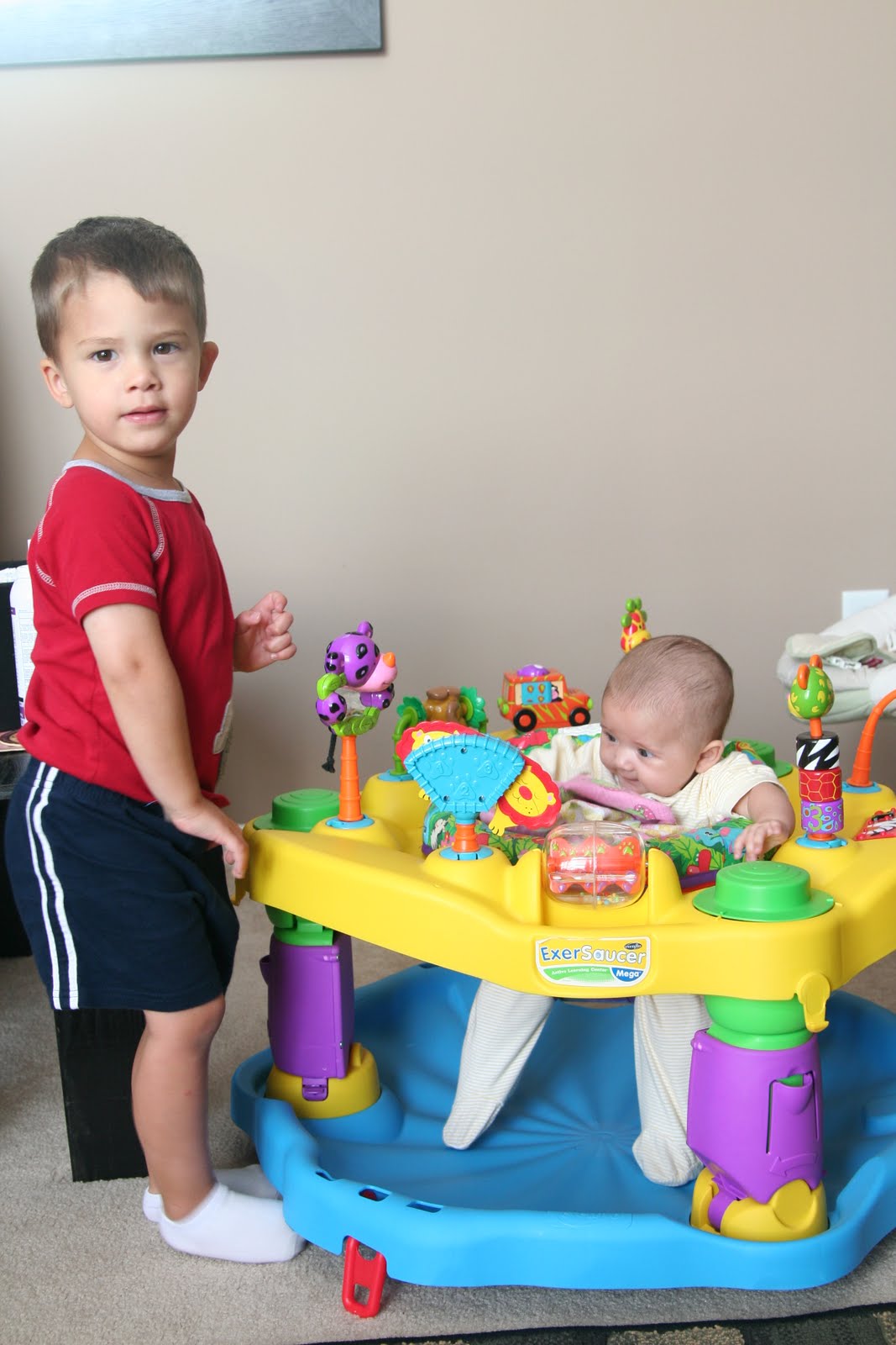 The Vernon Blog: Paige in the exersaucer