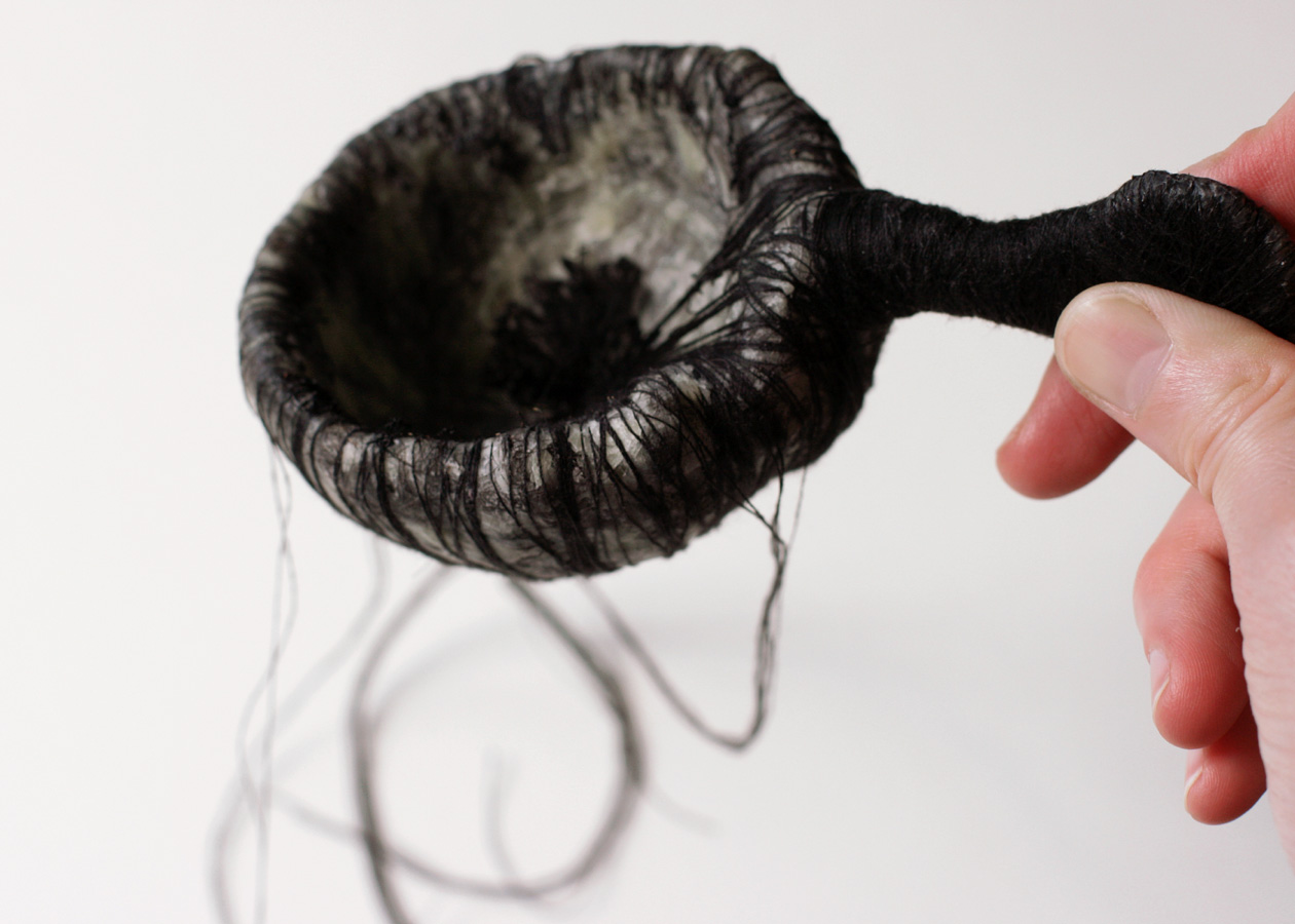 The Black Spoon, 2008. thread, hair, wax, paper & wire.