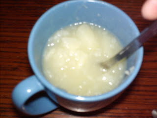 Mash potatoes in coffee cup.