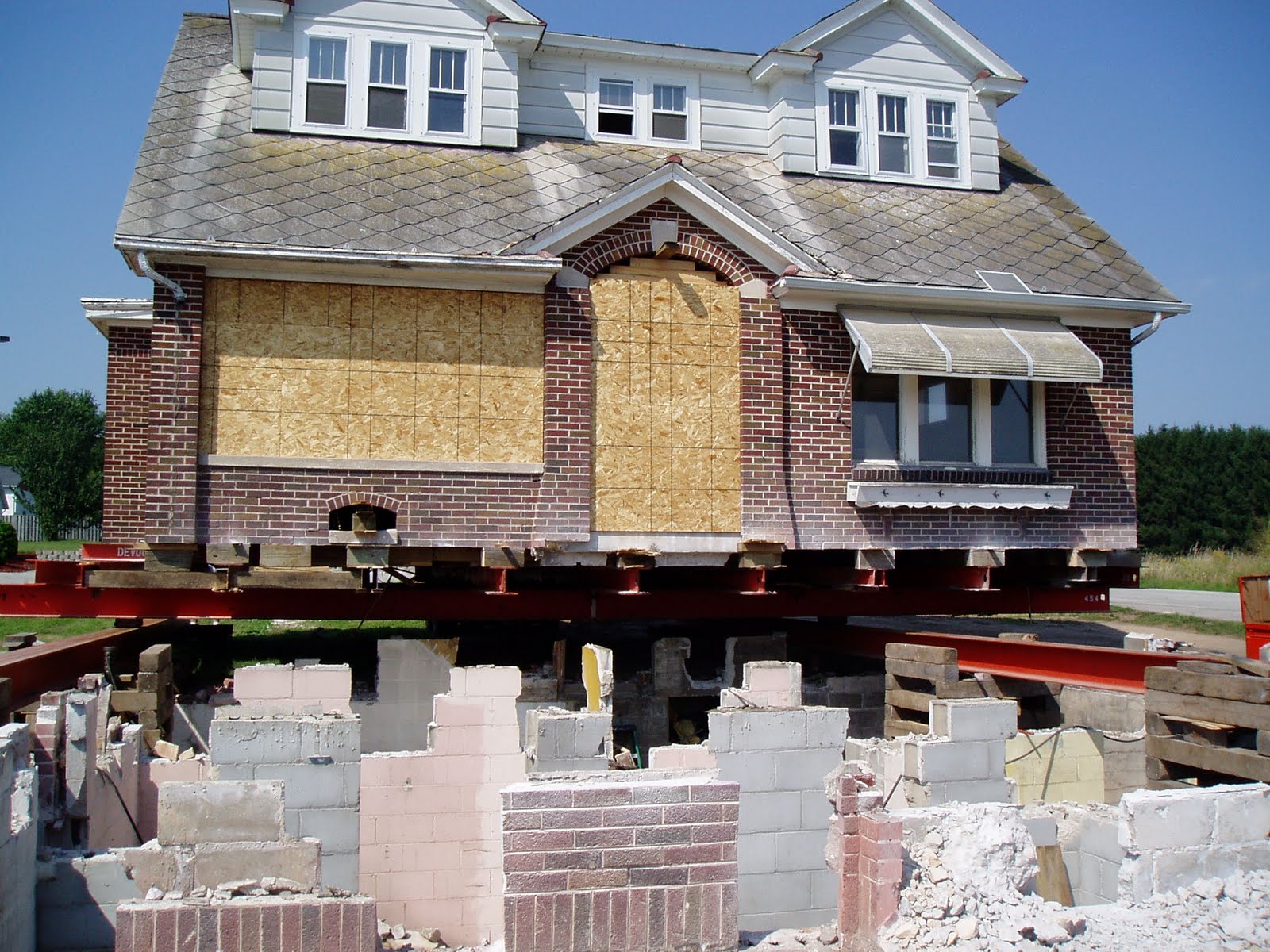 The Little Brick House in Manitowoc Cleaning more brick and raising