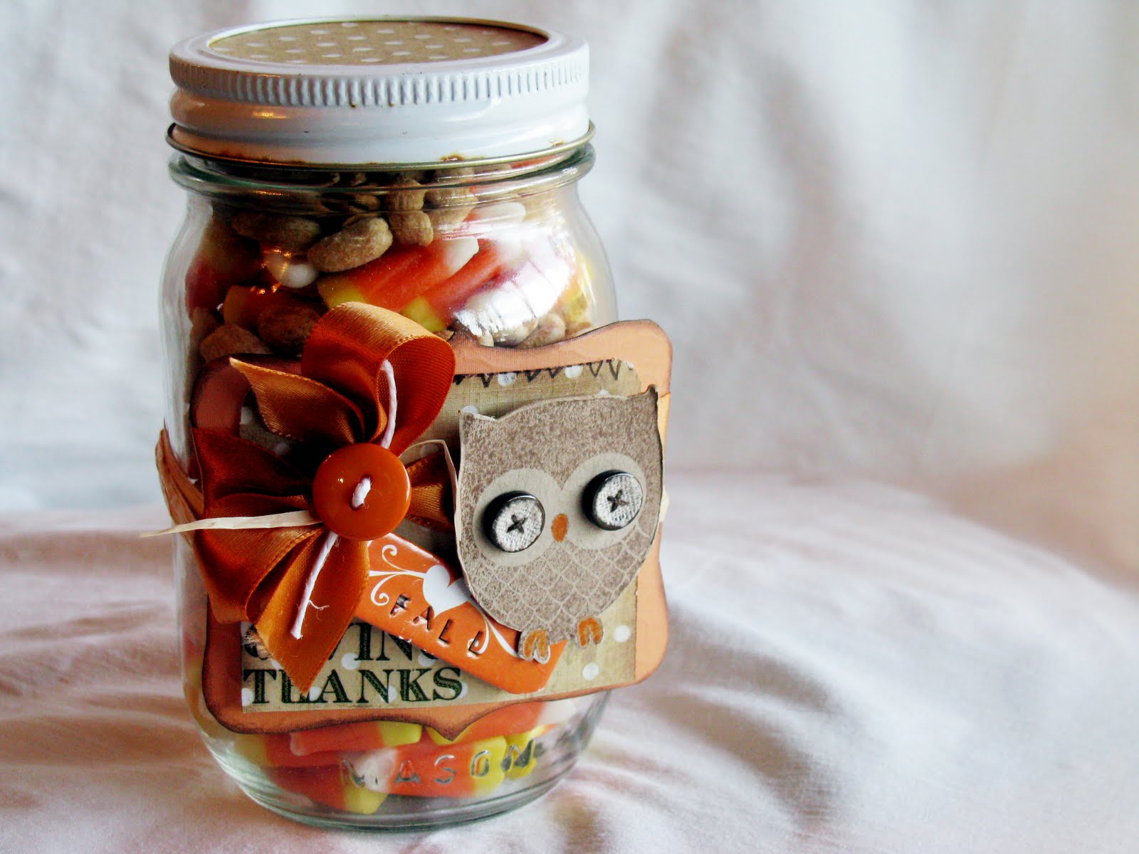 GCD Studios a mason jar filled with candy corn and peanuts....