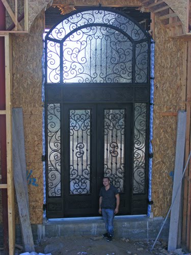 IWantThatDoor.com: Universal Iron Doors installs a huge wrought iron door.