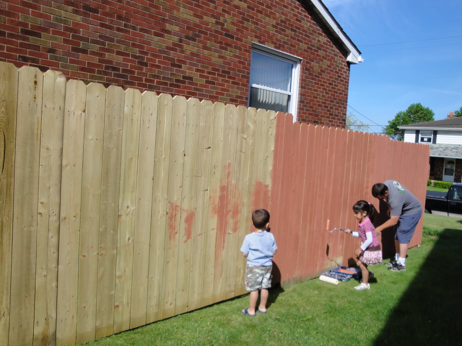 Travels and Wandering Painting the Fence.. a family thing.